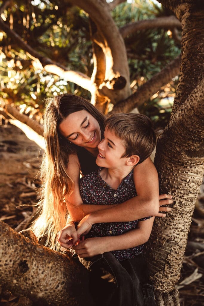 Byron Bay family photo shoot with kids playing in the sand at golden hour.