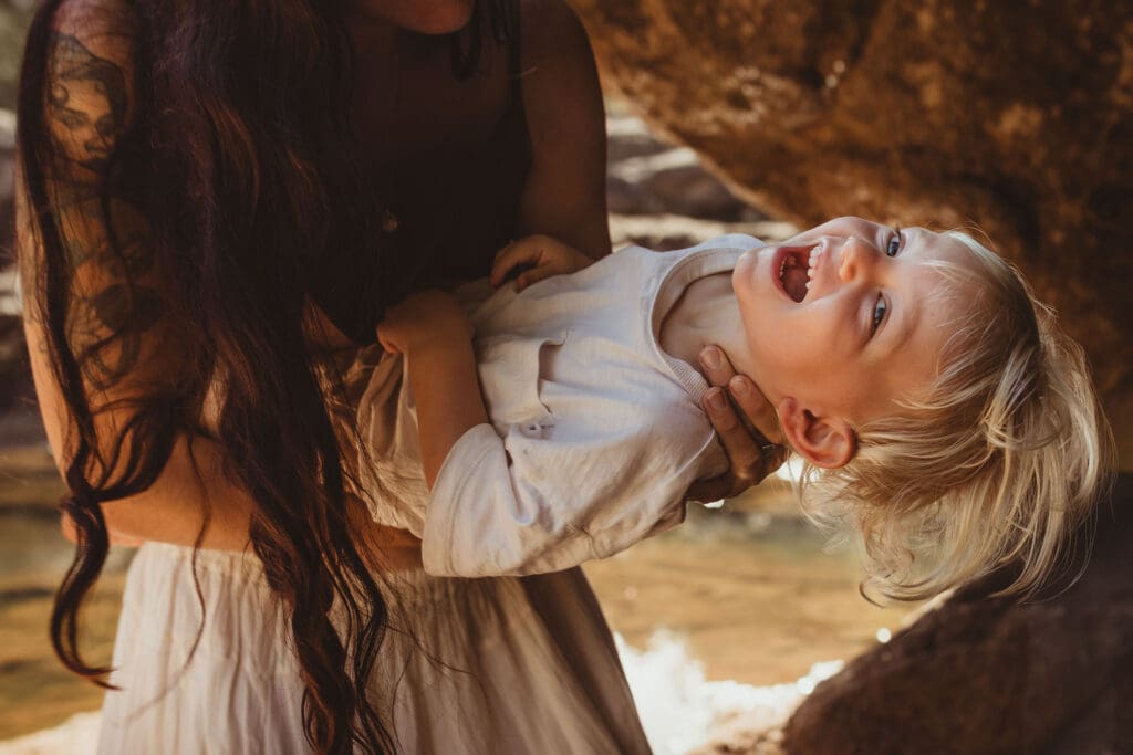 laughing child at a family photoshoot in byron bay