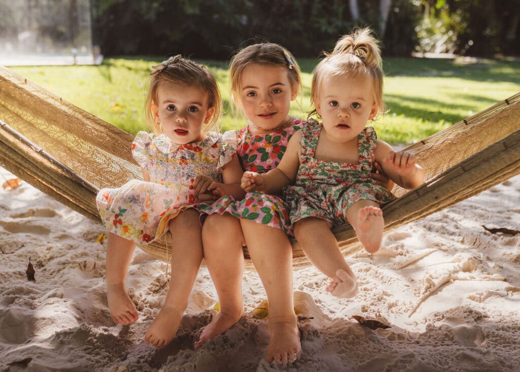 Extended family gathered outside a Byron Bay holiday home enjoying time together